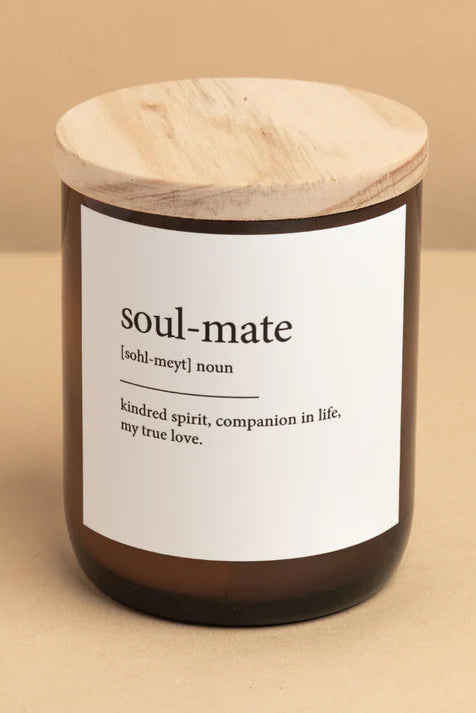 A candle with a wooden lid in a clear glass jar, labeled 'soul-mate' with a definition underneath.