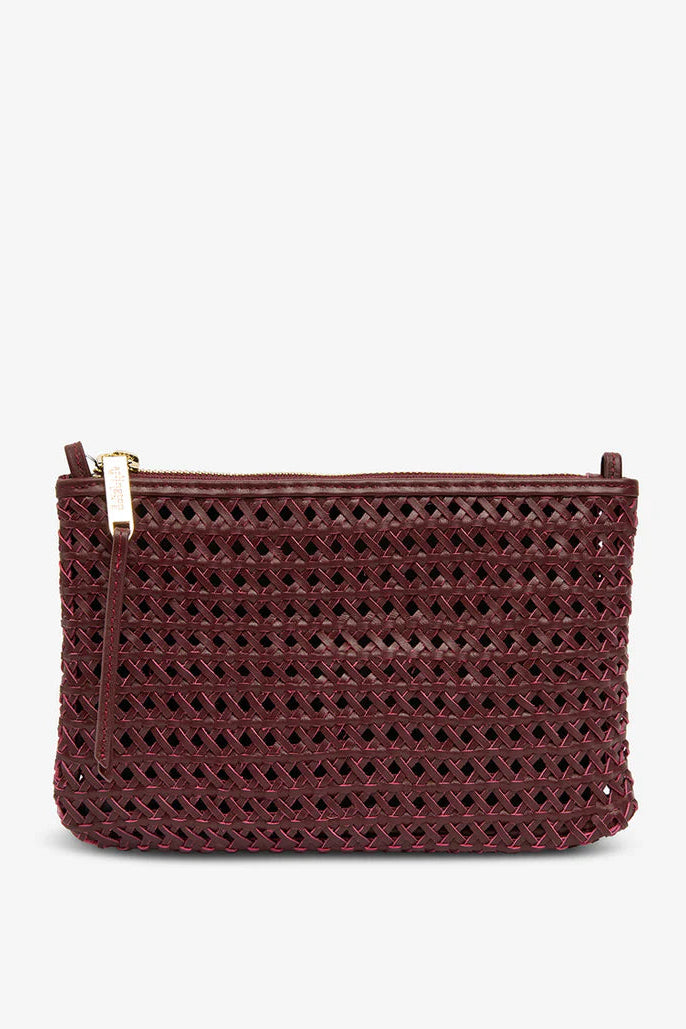Maroon woven clutch bag with gold zipper on a white background