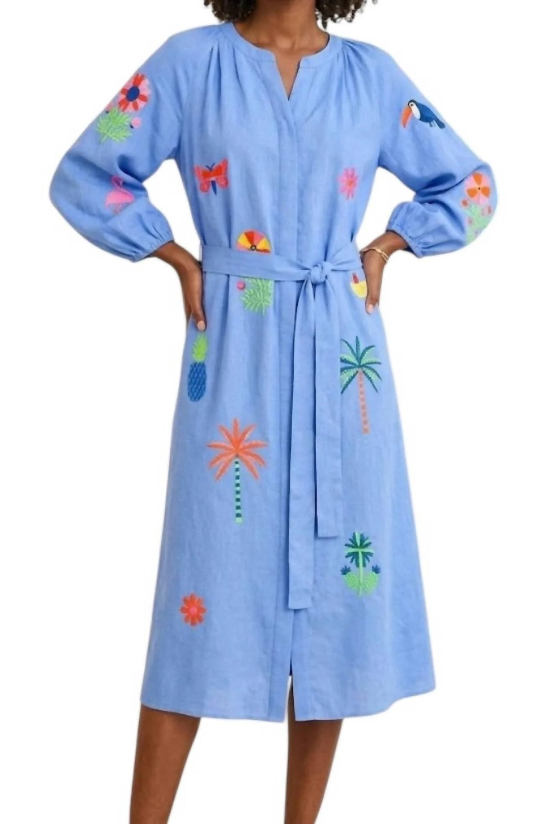 Light blue dress with tropical embroidery on a white background