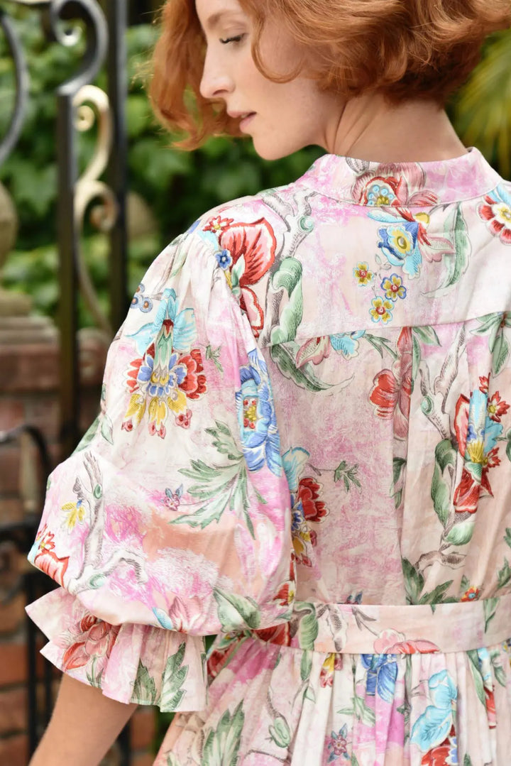 Woman wearing a floral dress with a blurred background