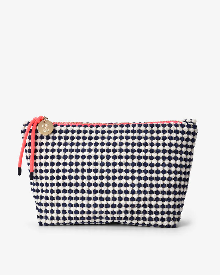 Navy polka dot pouch with pink zipper on a white background. Elms & King Napili Large Navy White