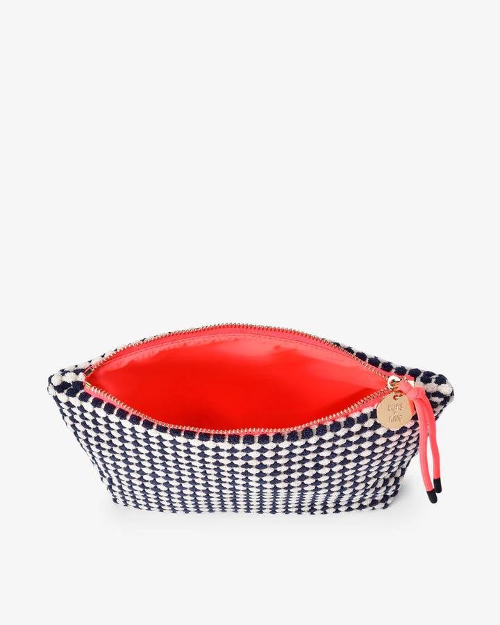 Small pouch with red interior and black and white checkered exterior on a white background. Elms & King Napili Large Navy White