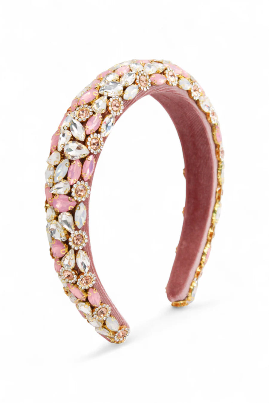 Pink headband with gemstone embellishments on a white background