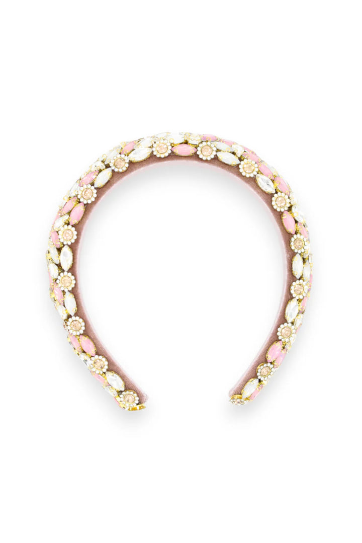 Decorative headband with pink and gold accents on a white background
