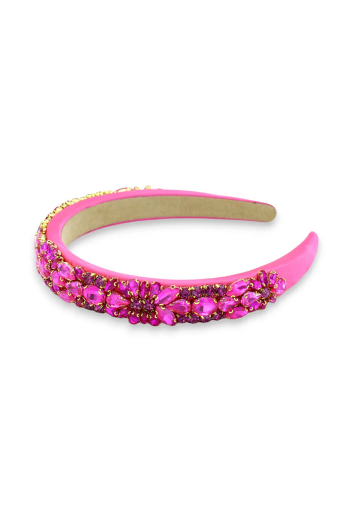 Pink headband with gemstones on a white background