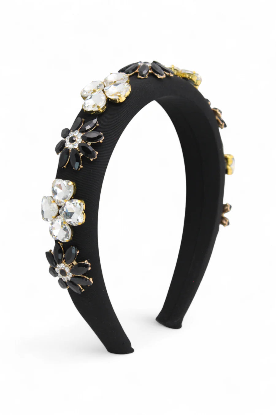 Black headband with floral embellishments on a white background