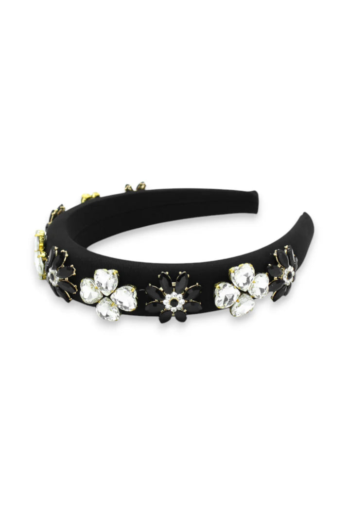 Black headband with floral and gemstone decorations on a white background