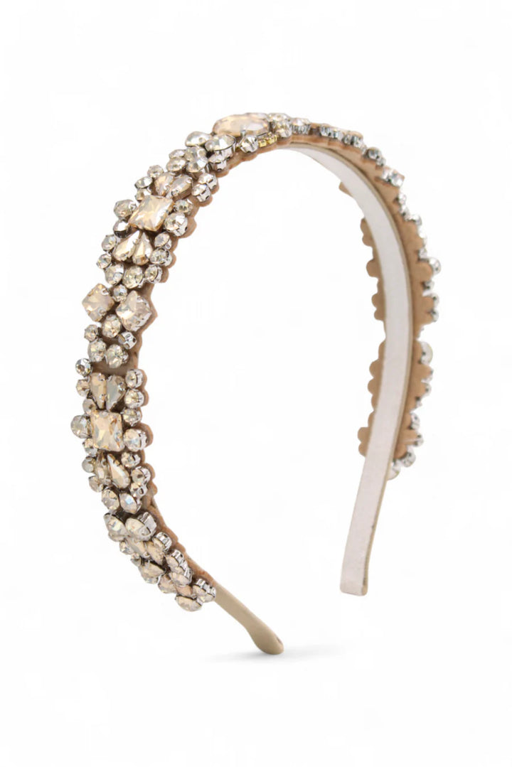 Decorative headband with pearls and crystals on a white background
