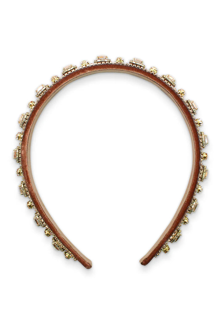 Brown headband with decorative elements on a white background