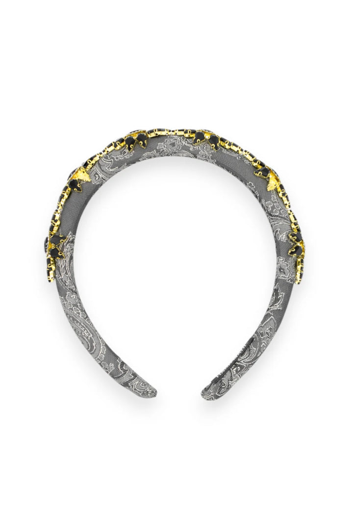 Decorative headband with textured design on a white background