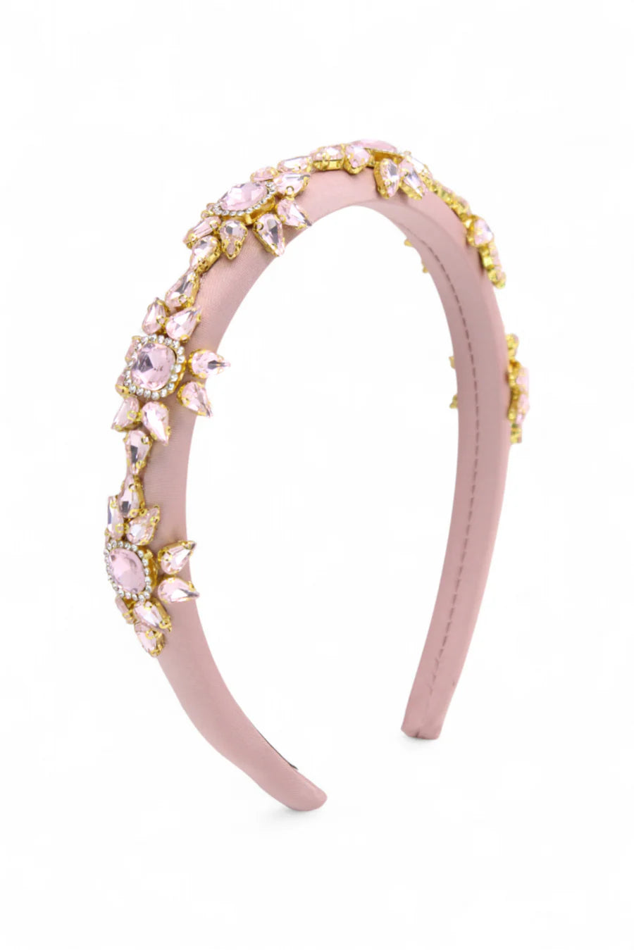 Pink headband with decorative stones on a white background