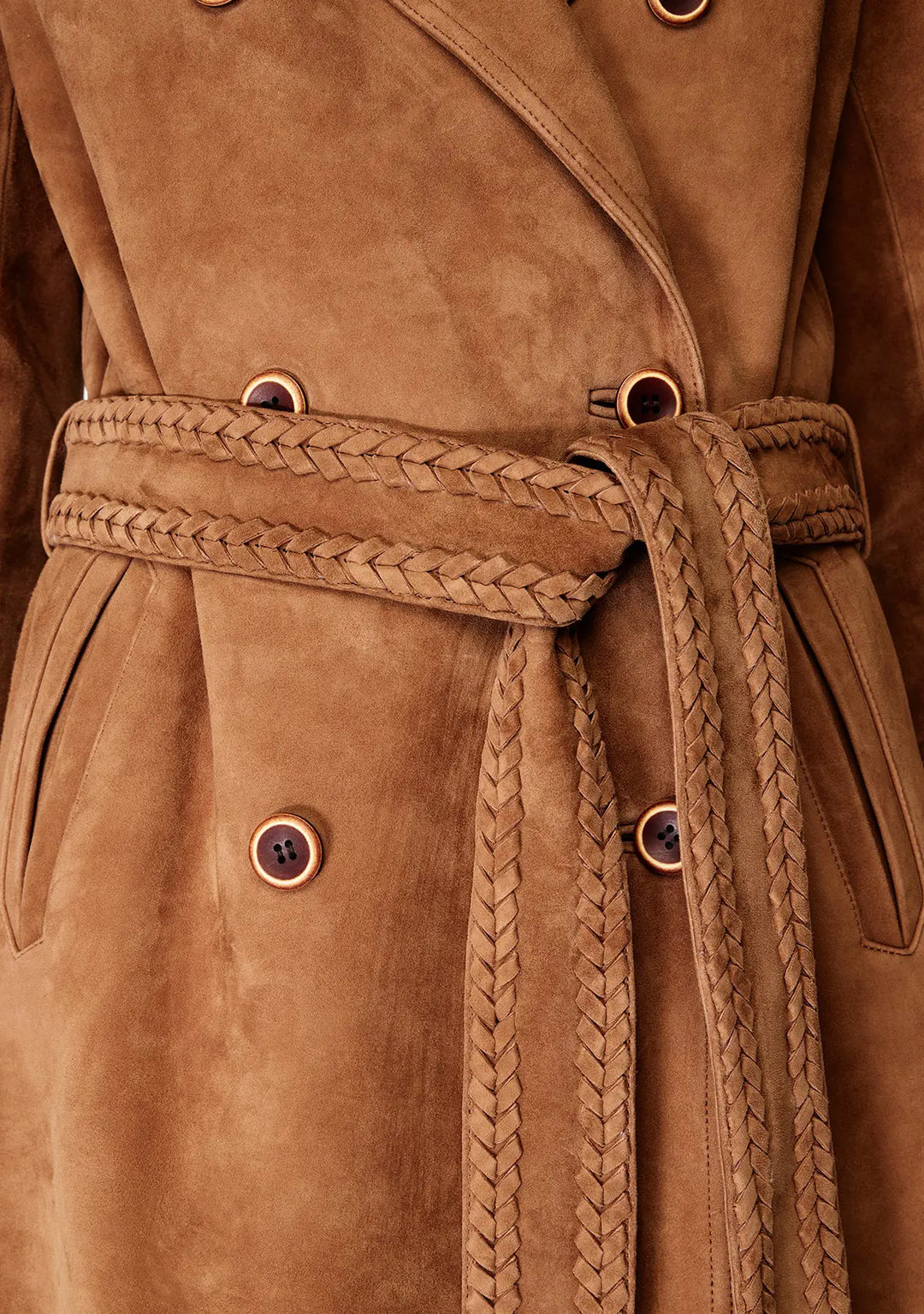 Close-up of a brown suede coat with braided belt and button details