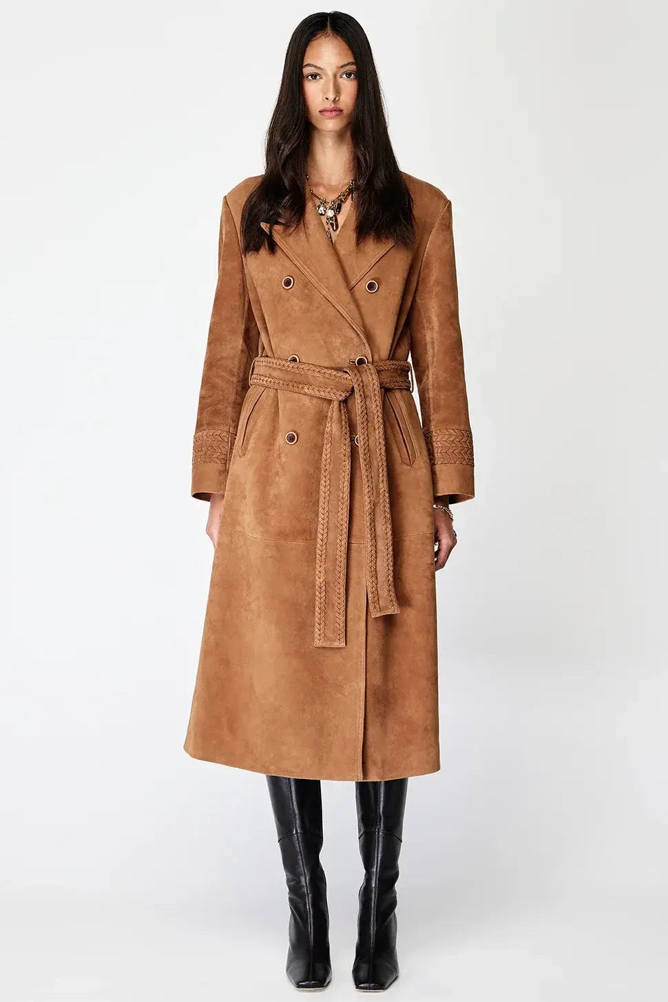 Woman wearing a brown coat on a white background