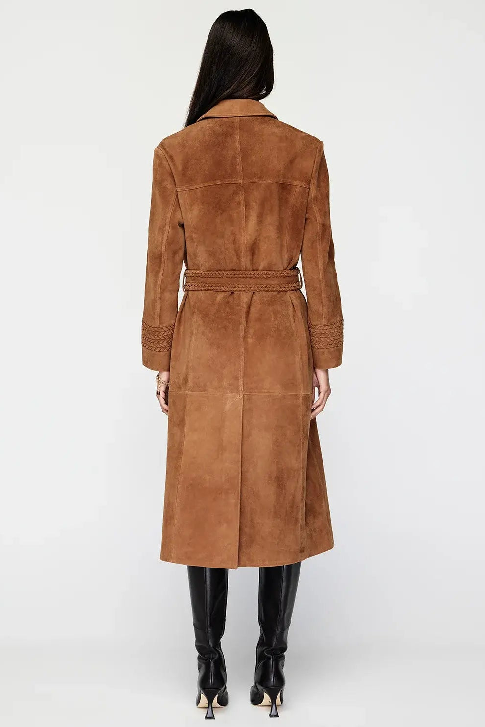 Brown suede coat worn by a person on a white background