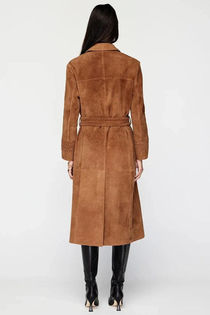 Brown suede coat worn by a person on a white background