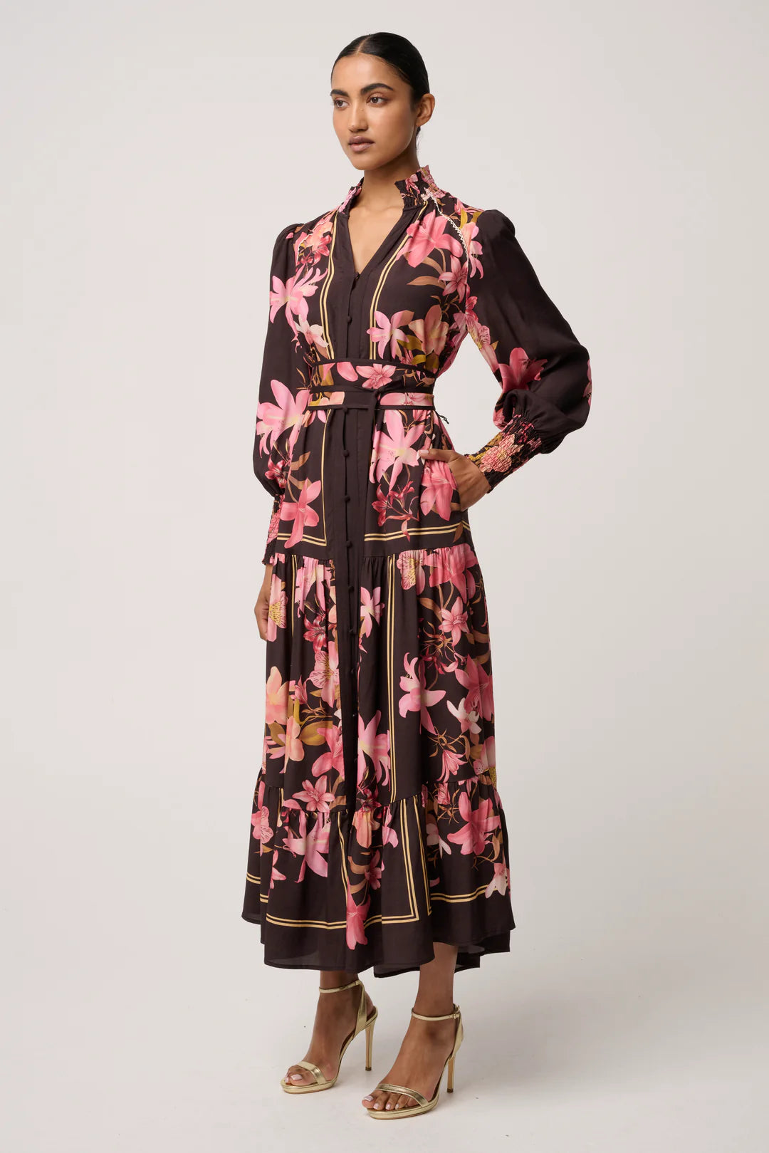 Woman wearing a floral dress with a white background