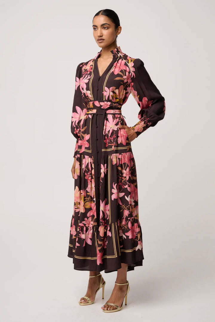 Woman wearing a floral dress with a white background
