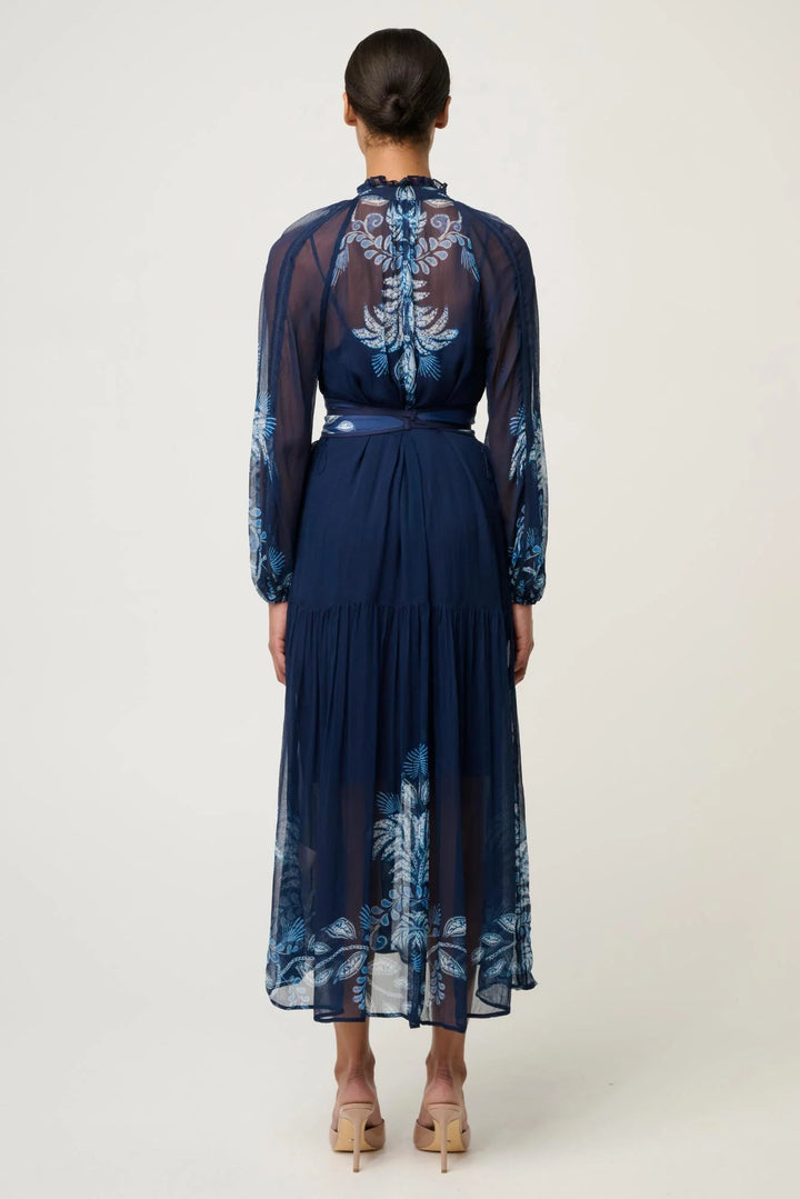 Navy blue dress with floral patterns on a white background