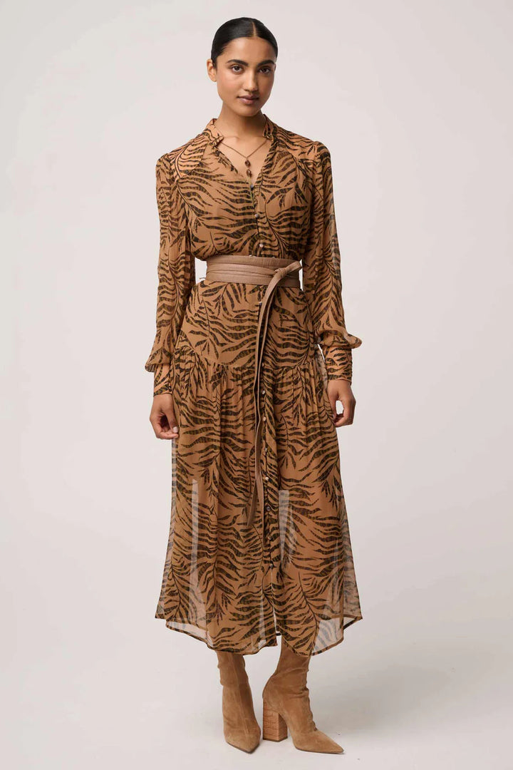 Woman wearing a brown tiger pattern dress on a white background
