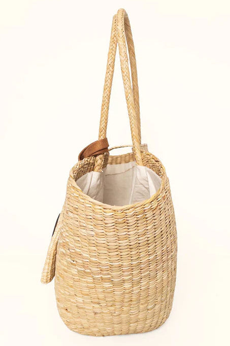 Woven straw bag with a handle on a white background. Orange Inca Playa Tote Natural