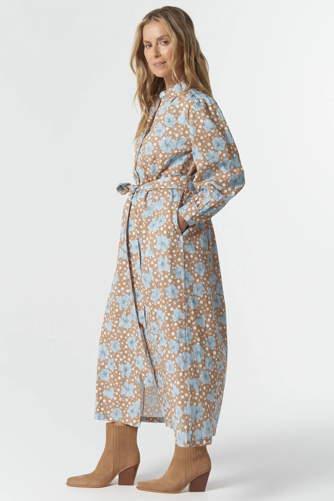 Woman wearing a floral dress on a white background