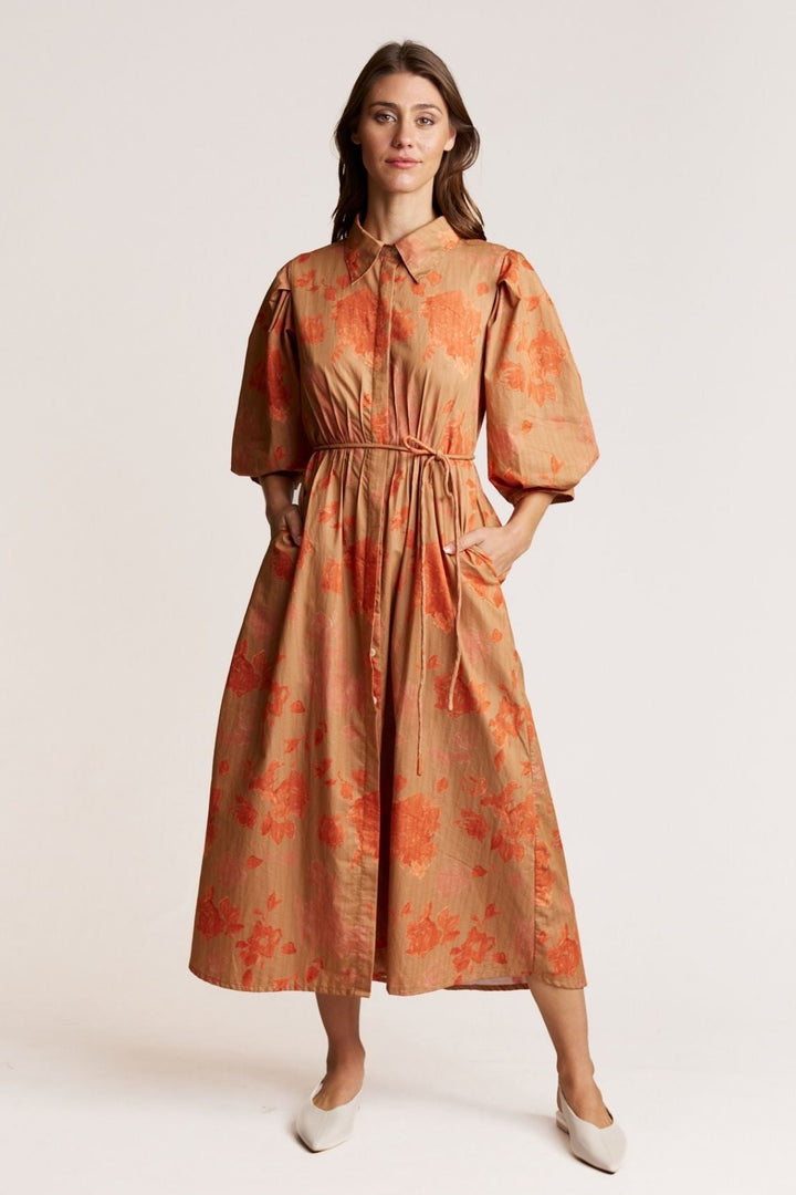Woman wearing a floral dress on a white background