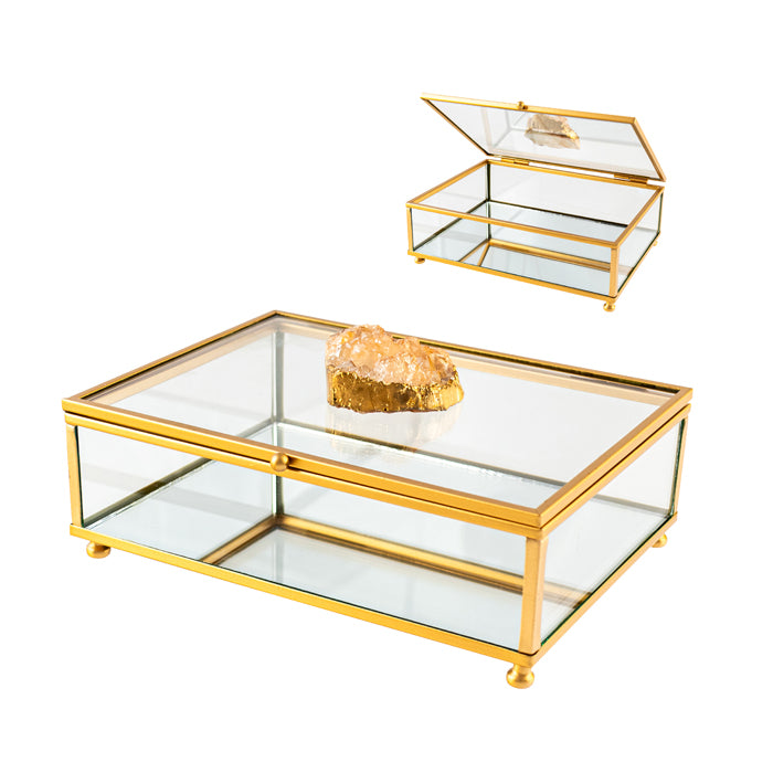 Glass boxes with gold frames on a white background