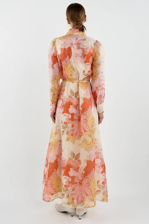 Woman wearing a floral dress on a white background