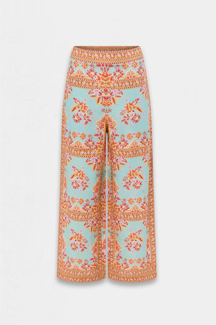 A pair of wide-leg cropped pants featuring a light blue base with a vibrant orange and pink floral pattern, displayed against a clean white background.